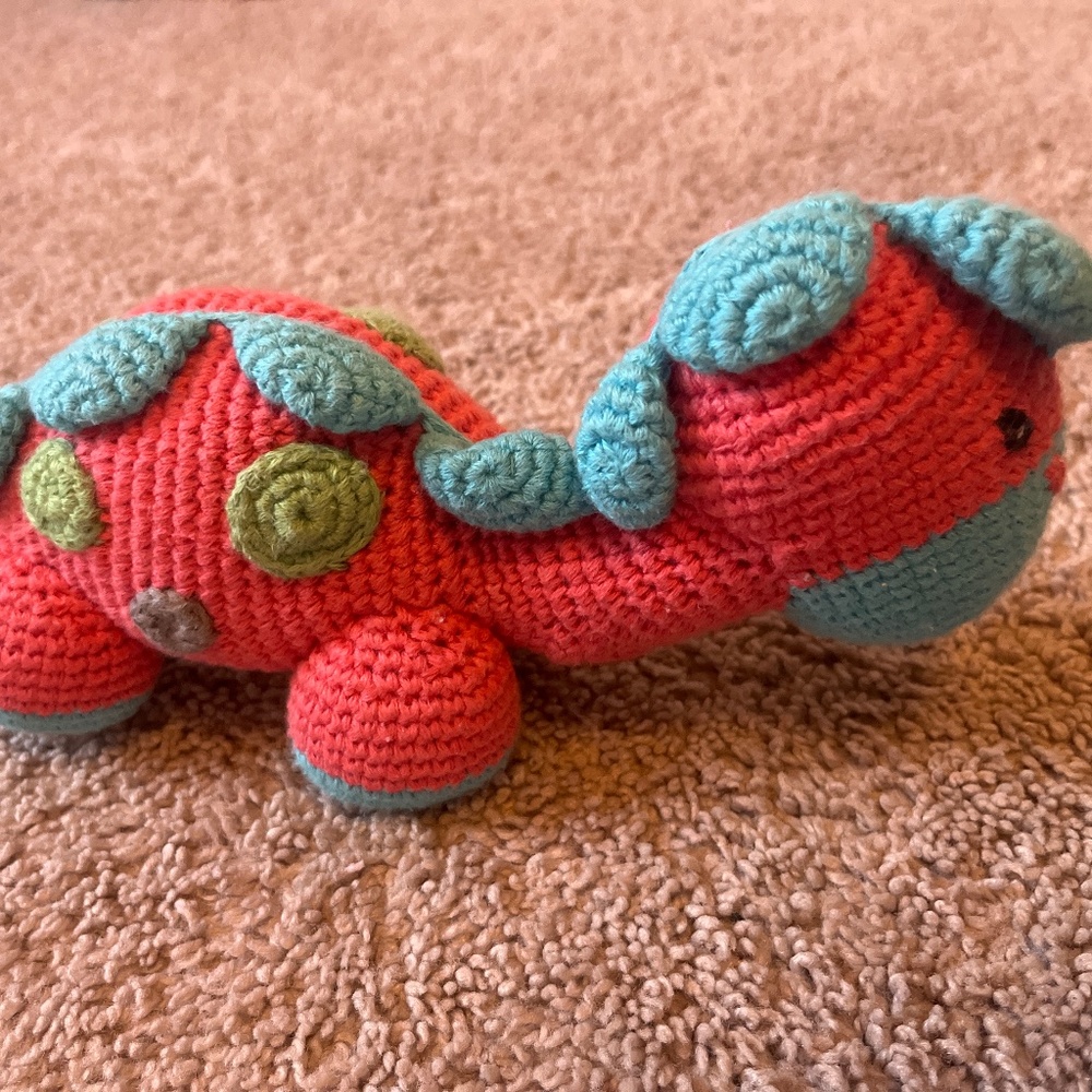 Pebble rattle dinosaur
